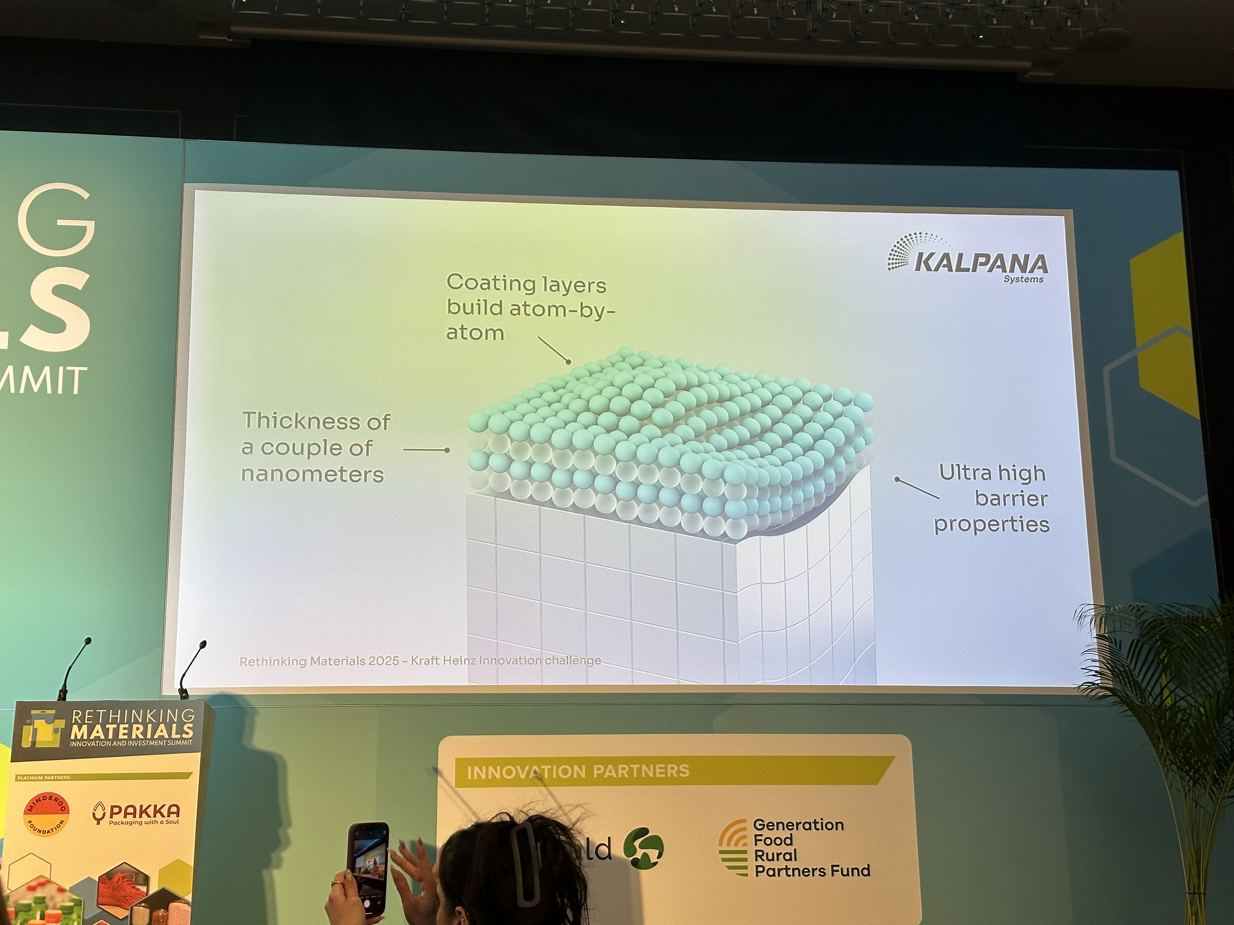 Kalpana Systems nanoscale coating technology slide showing atom-by-atom layering with barrier properties, making the barrier layers negligible for recycling systems.