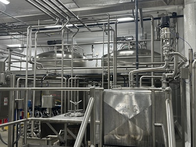 Two large mix tanks connect to a liquefier as part of the base mix production process for TCCA's ice cream.