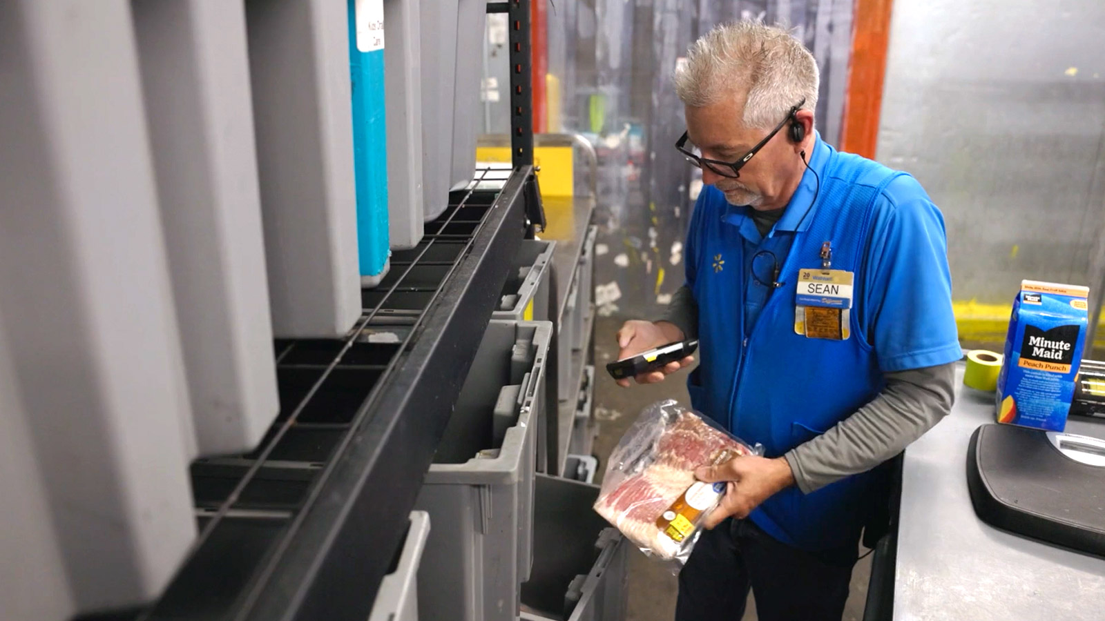 Walmart associate handling fresh food.