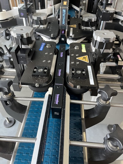 The stainless steel, split-belt conveyor system provides precise control for consistent label placement.