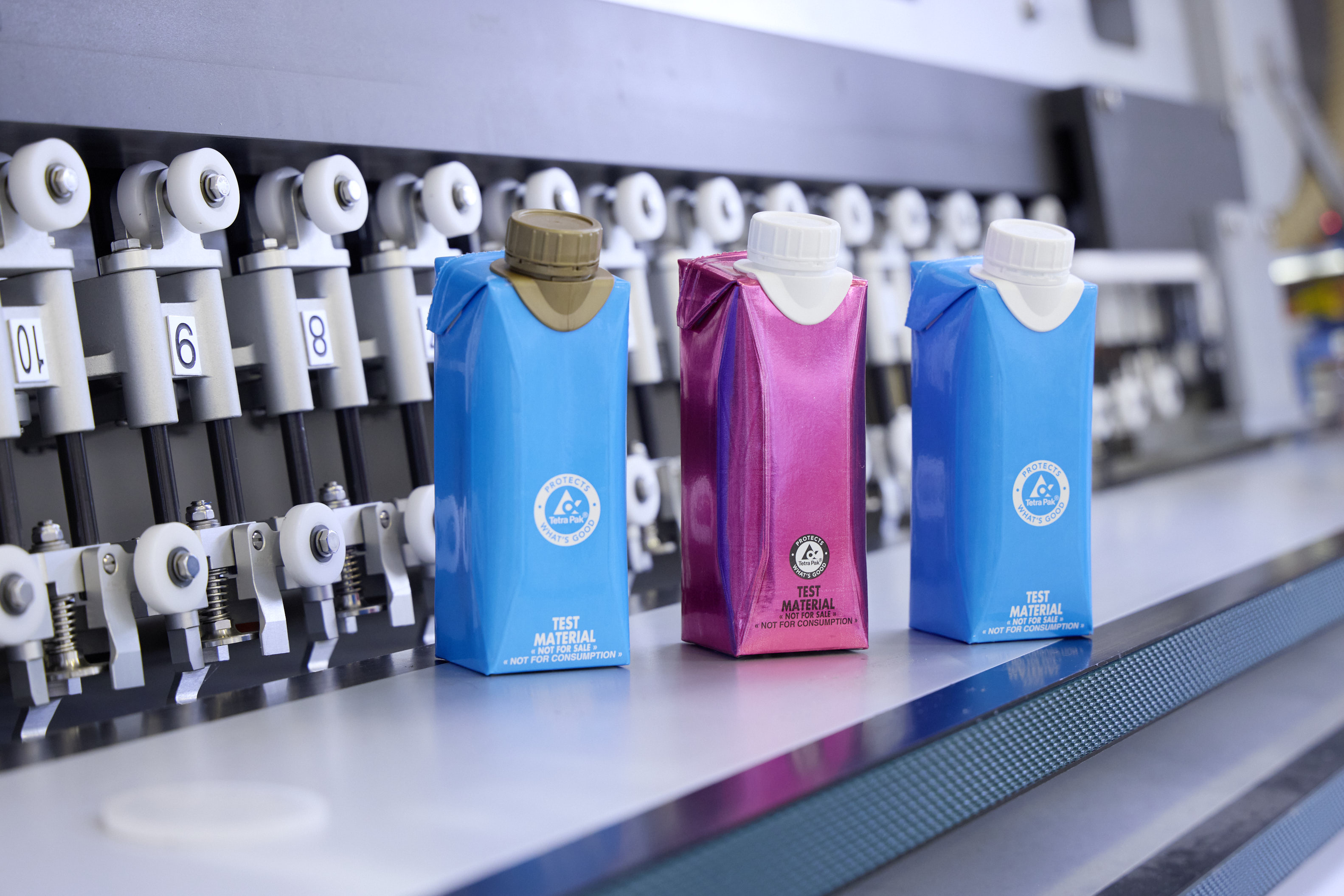 Tetra Pak&circledR; test packs with plastic caps glued on.