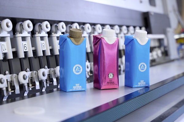 Tetra Pak® test packs with plastic caps glued on.