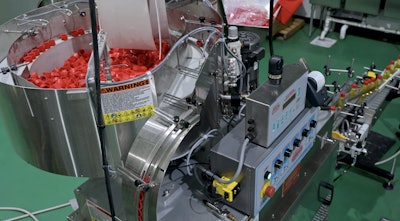 The 8-spindle capper handles both the Slamzees cap that has a 64-mm diameter and the pickle potion caps that have a 28-mm diameter.