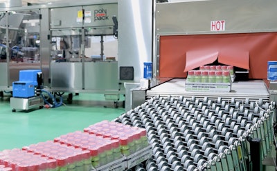 Shown here are shrink-wrapped trays exiting the shrink tunnel.