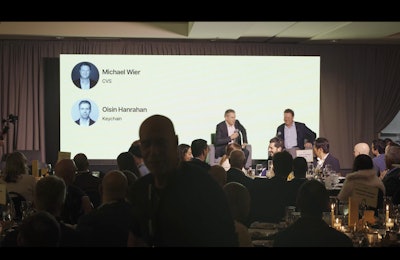 Keychain founder Oisín Hanrahan (left) speaks with Michael Wier, VP of Store Brands at CVS, about how Keychain 360 is designed to help retailers manage large private-label portfolios—potentially up to 8,000 SKUs—while supporting more localized assortments and packaging strategies.