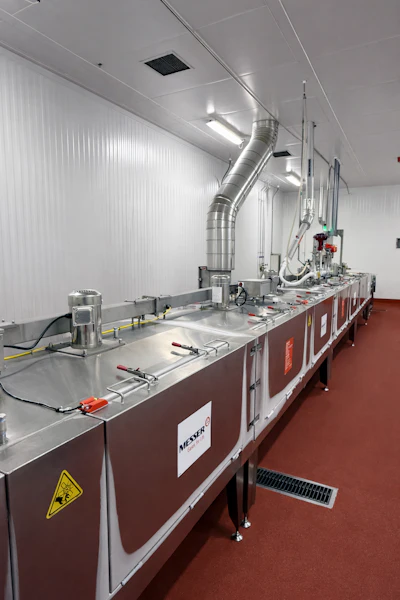 Once made, pizzas are run through a nitrogen tunnel freezer prior to packaging.