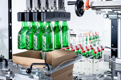 The robotic pick-and-place system loads bottles of cleaning product into erected cases, ensuring precise, consistent packing while supporting high-speed, automated operation.