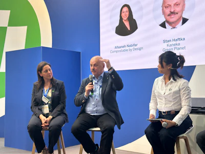 Afsaneh Nabifar of Compostable by Design/BASF (left) and Stan Haftka of Kaneka Green Planet (speaking) discuss certification, infrastructure, and end-of-life realities for compostable packaging during a panel discussion at interpack 2026. Maria Monique Murillo of Taghleef Industries moderated the session.