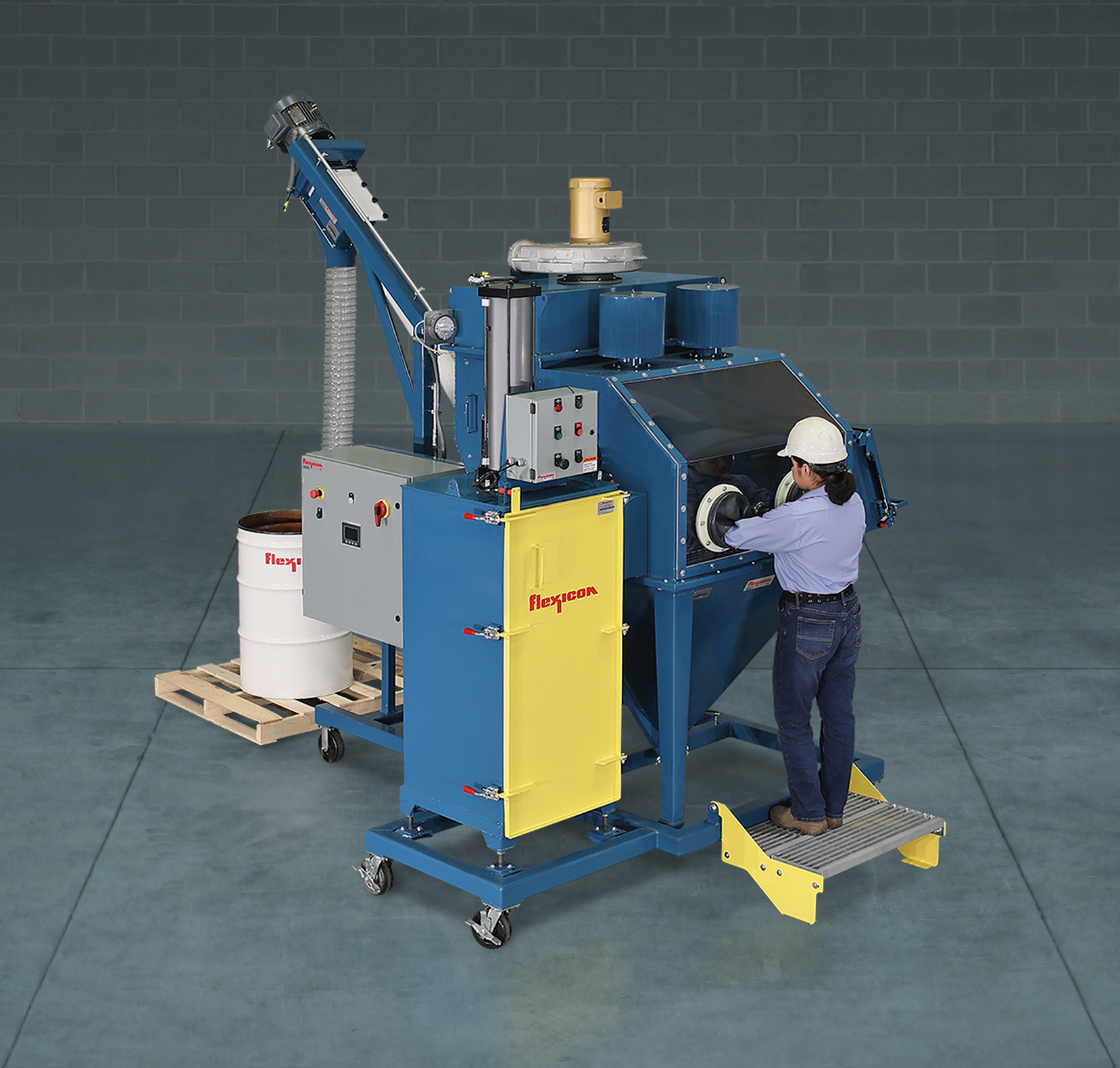 Industrial wire stripping machine with blue frame and yellow panels, operated by worker wearing hard hat and safety gear