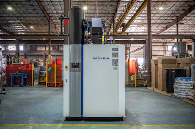 Miura industrial boiler system in factory warehouse with metal framework and equipment