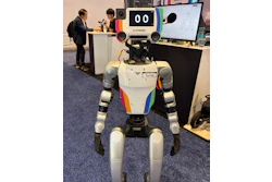 Sumay, a humanoid powered by OpenMind's software, draws a crowd at Automate 2026's Humanoid Robot Pavilion. The engineering impresses, but bipedal humanoids remain a few cycles away from the packaging floor.