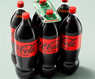 Four Coca-Cola Zero Sugar bottles with red caps arranged with green promotional packaging displaying 1.75L volume