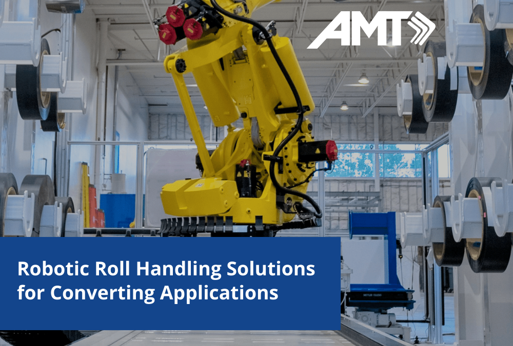 Yellow industrial robotic arm handling rolls in manufacturing facility with AMT branding