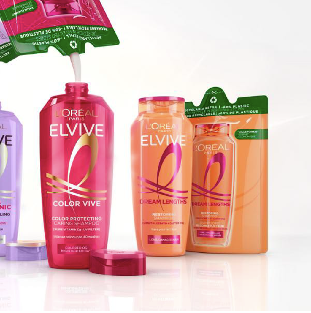 L'Oreal Elvive hair care product lineup featuring Color Vive and Dream Lengths shampoos in pink and orange bottles