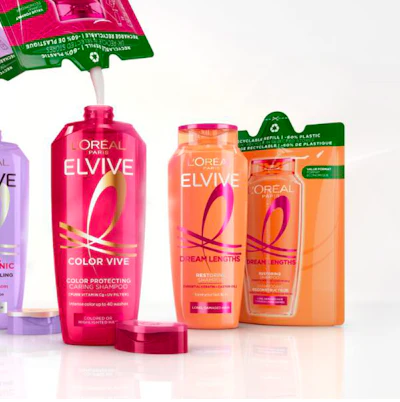 L'Oreal Elvive hair care product lineup featuring Color Vive and Dream Lengths shampoos in pink and orange bottles