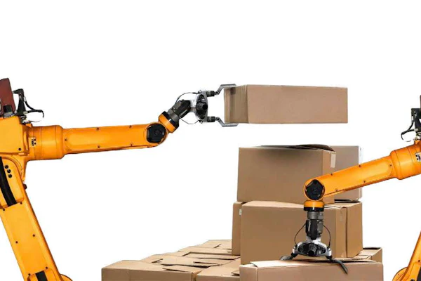 Two yellow industrial robotic arms handling cardboard boxes in an automated warehouse setting